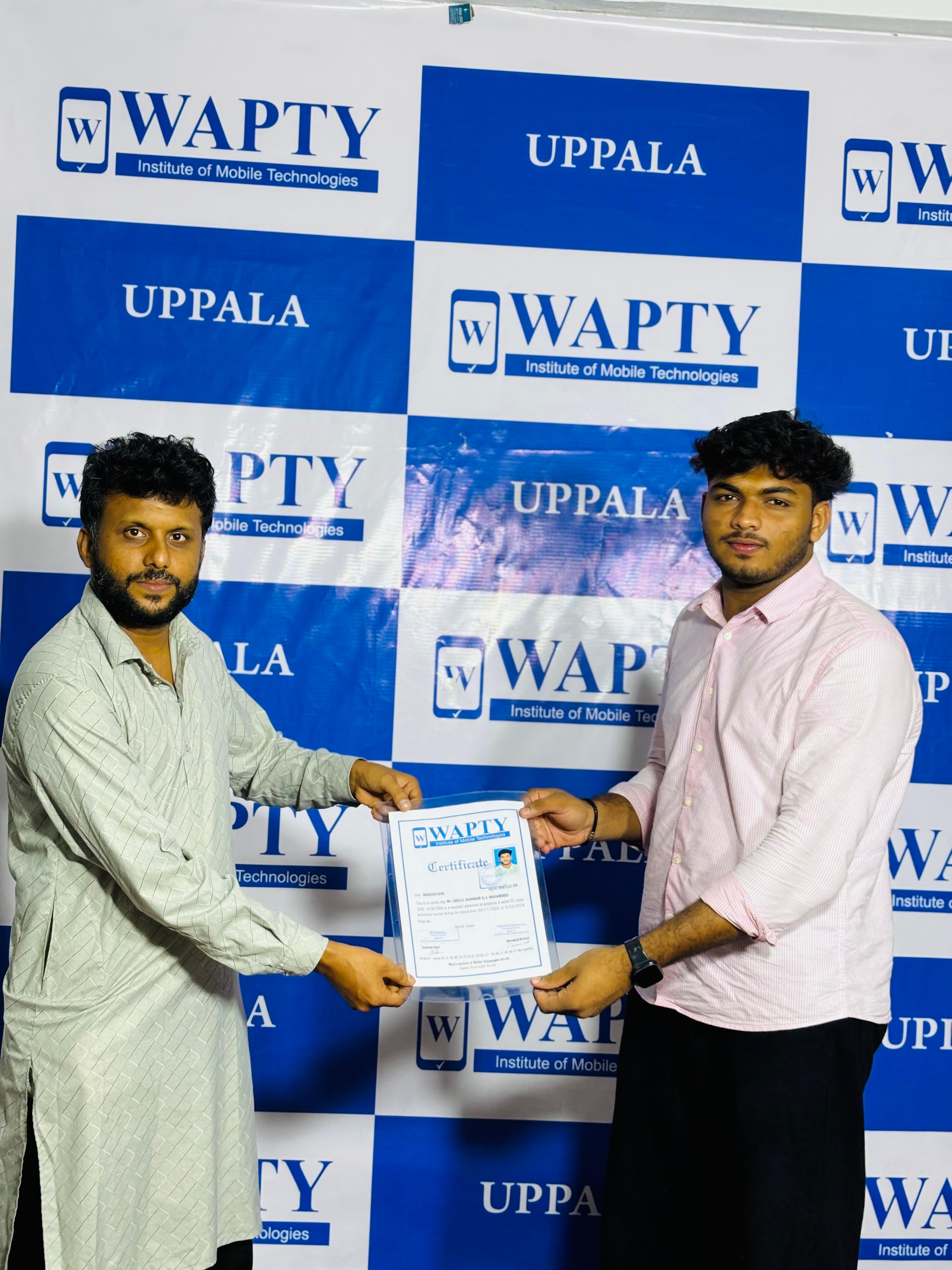 Students learning mobile app development in a classroom