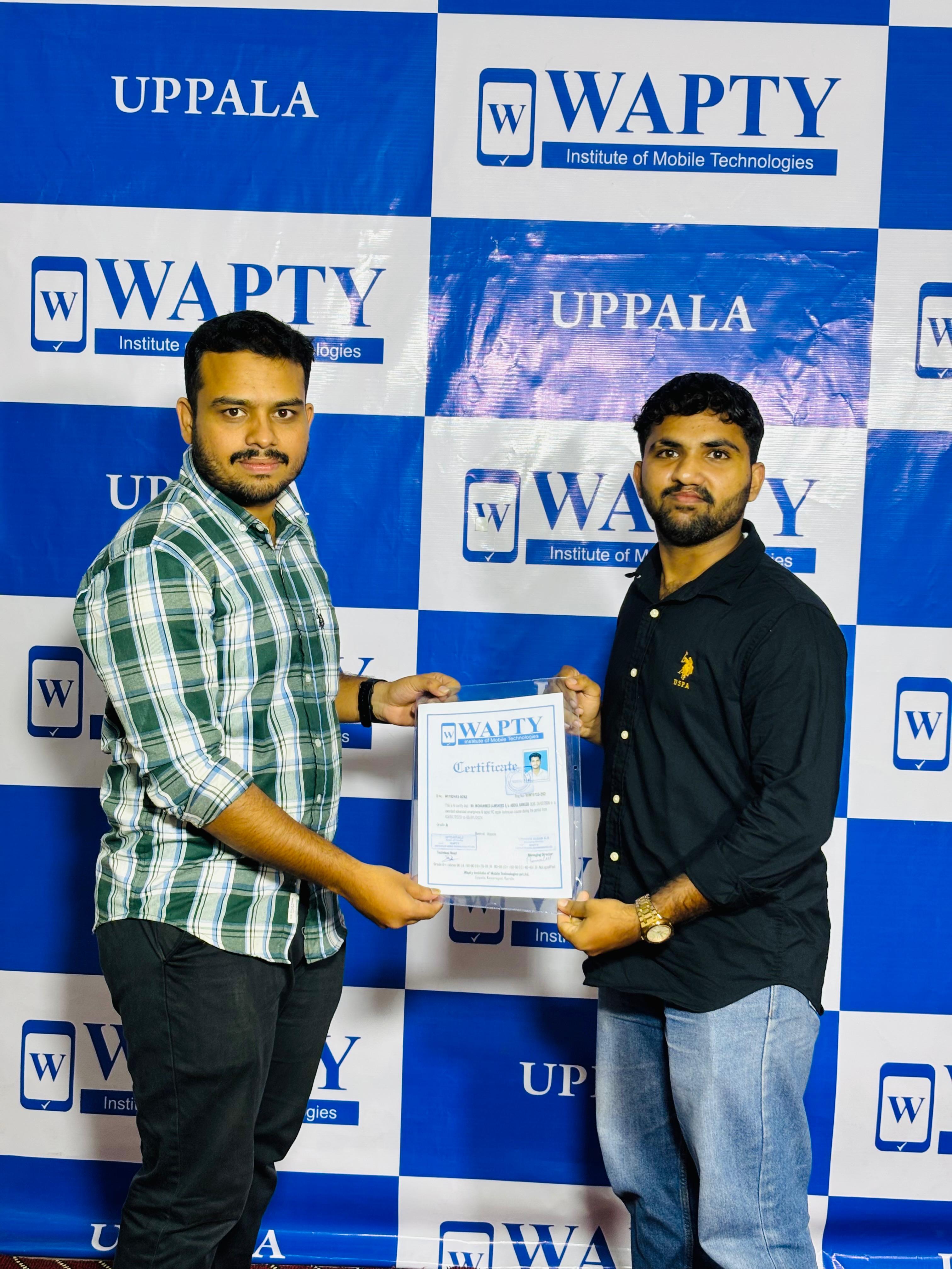 Students learning mobile app development in a classroom