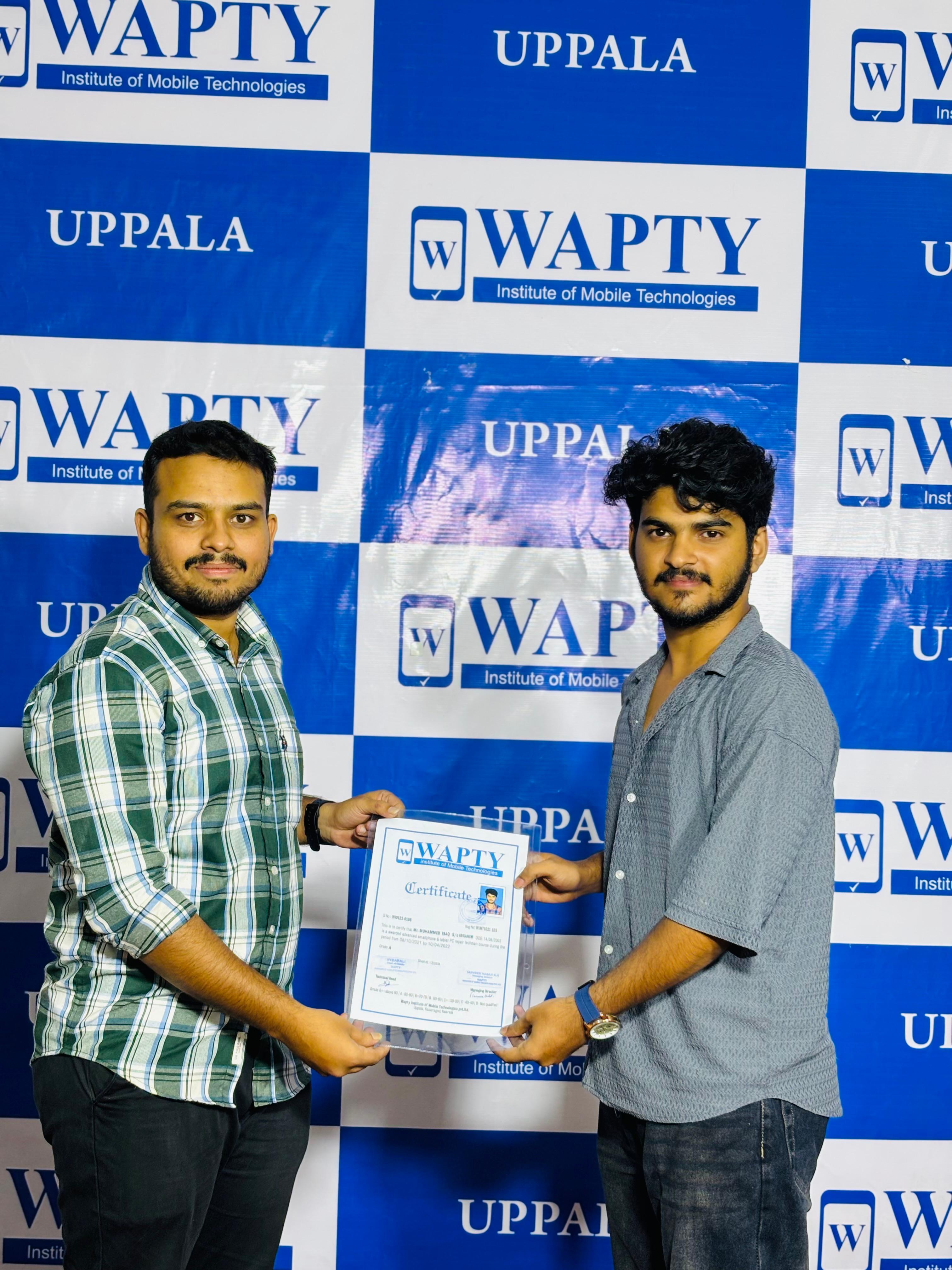 Students learning mobile app development in a classroom