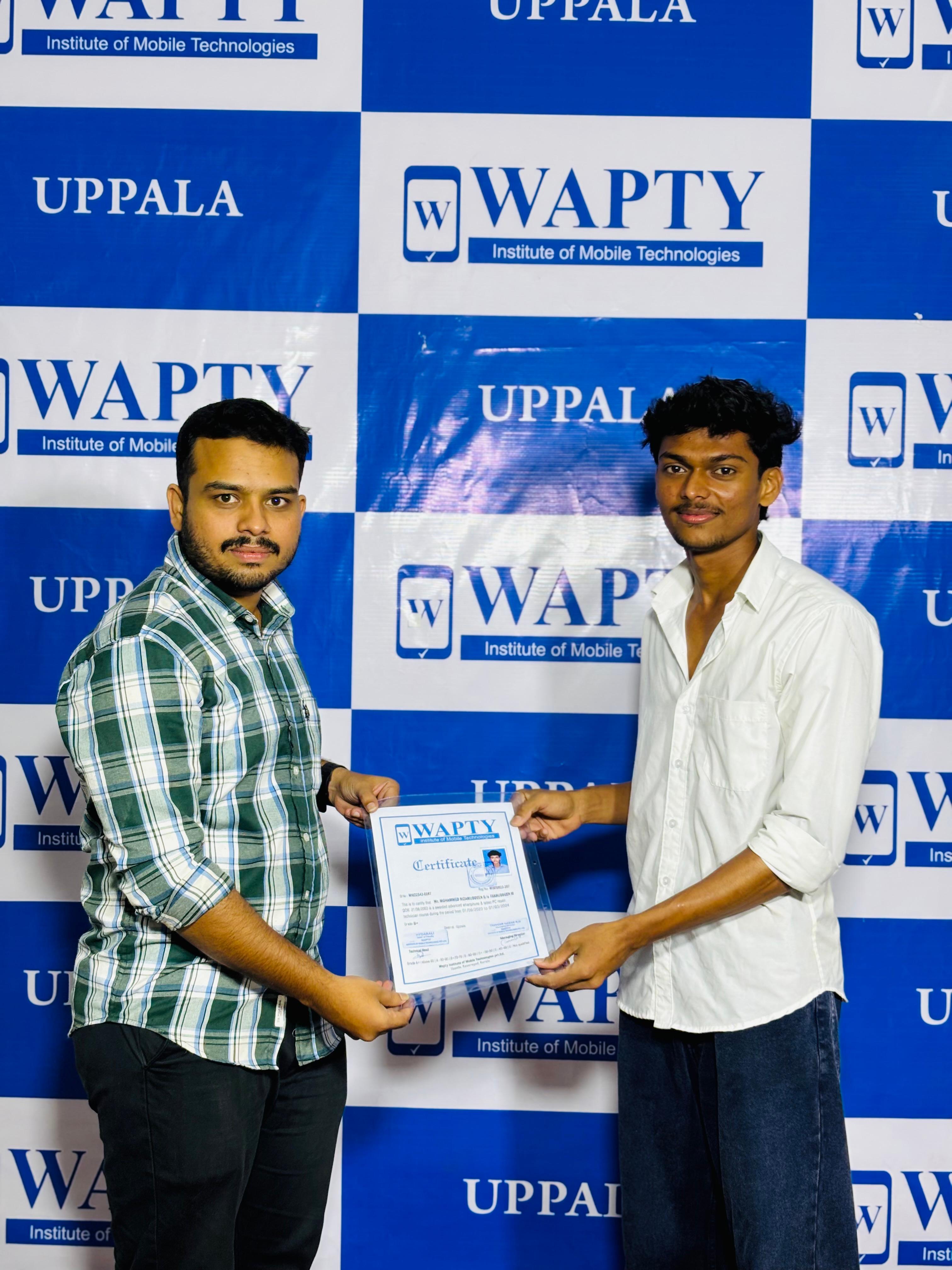 Students learning mobile app development in a classroom