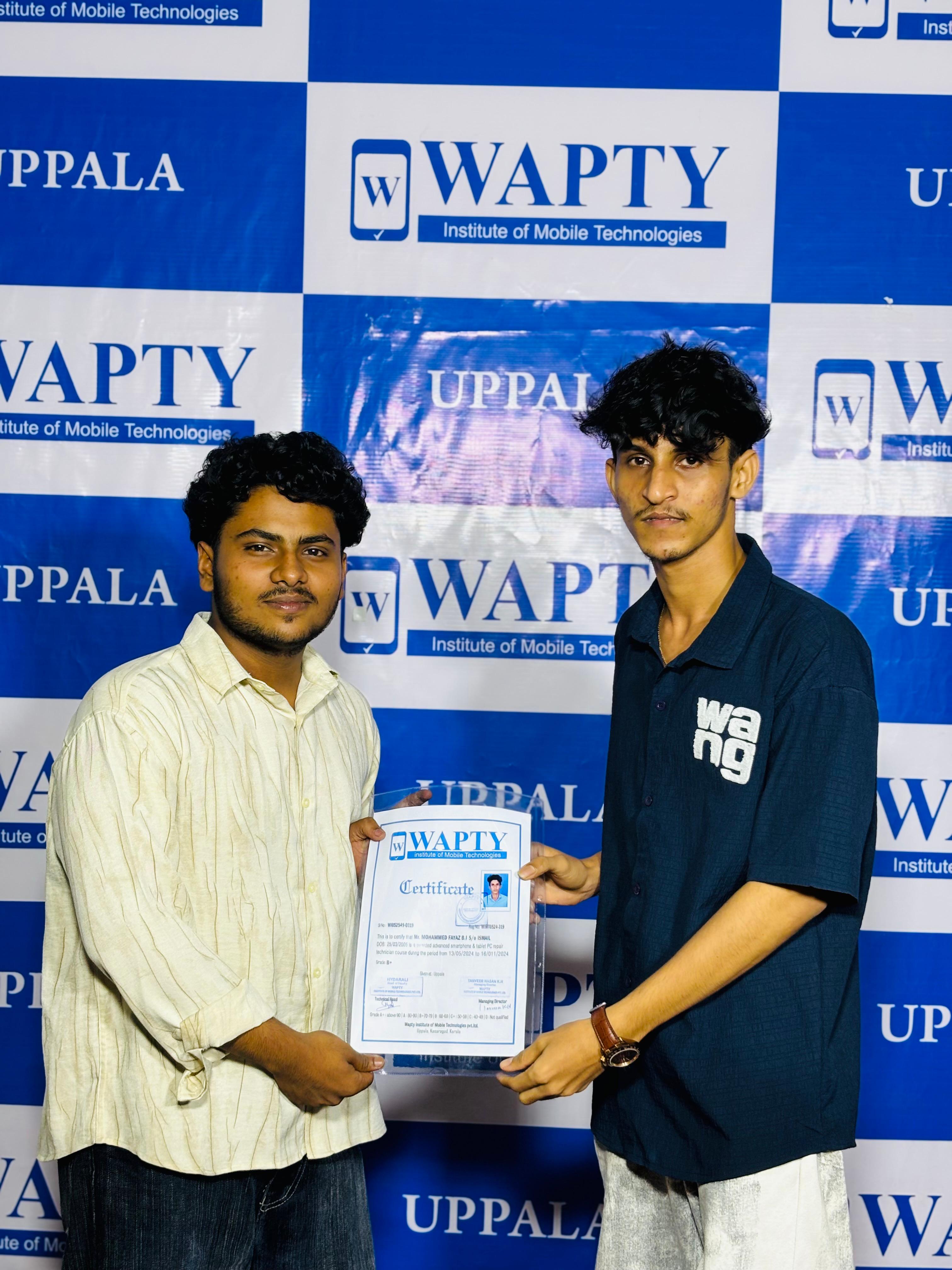 Students learning mobile app development in a classroom