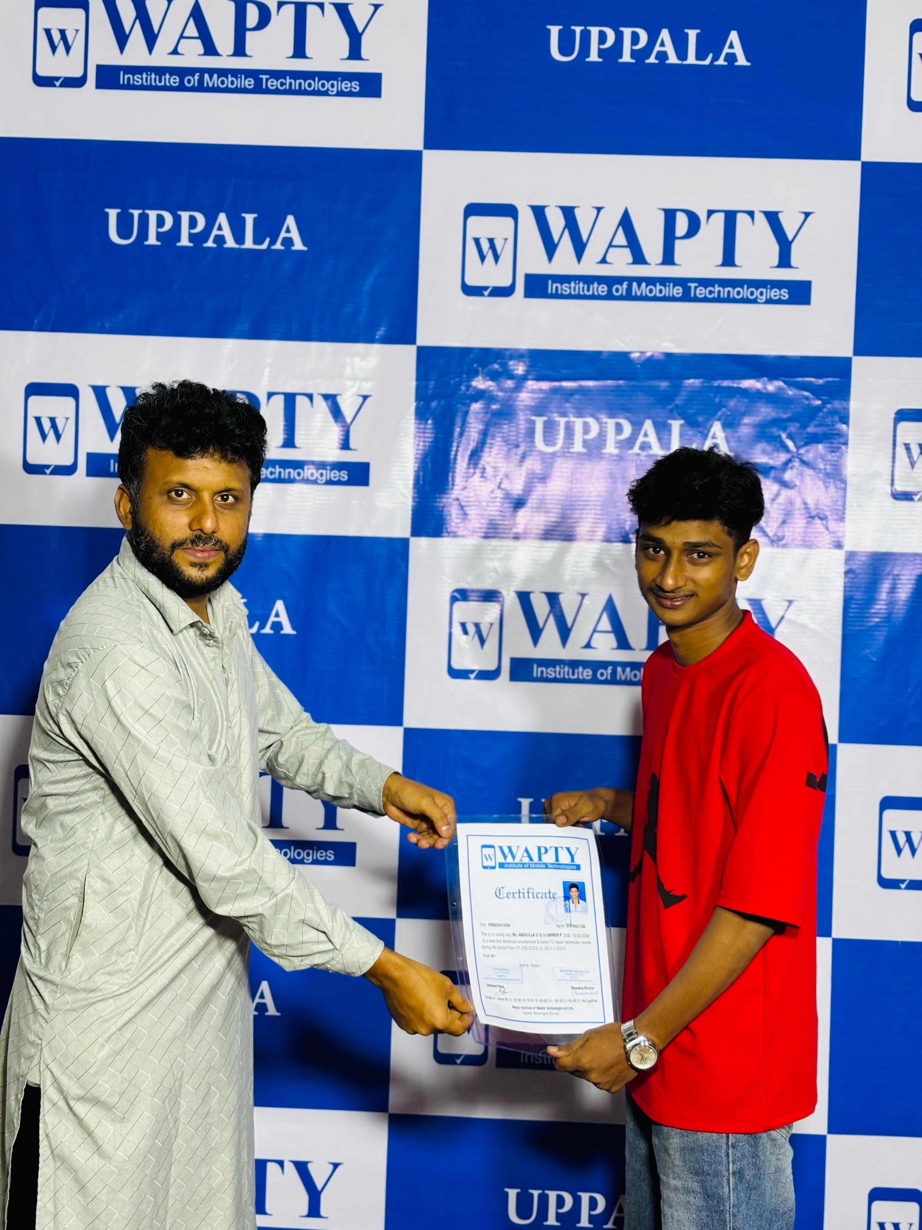 Students learning mobile app development in a classroom