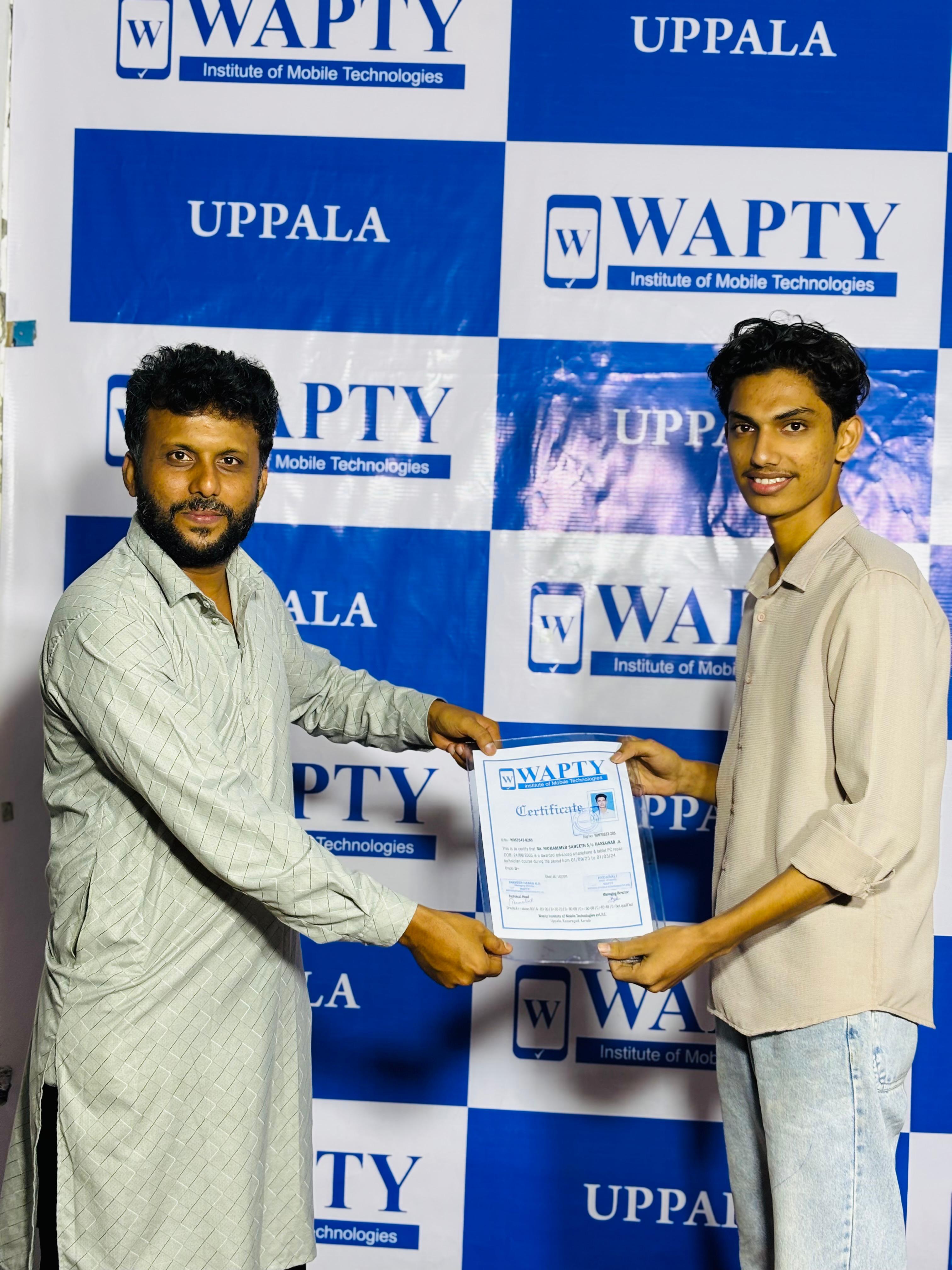 Students learning mobile app development in a classroom