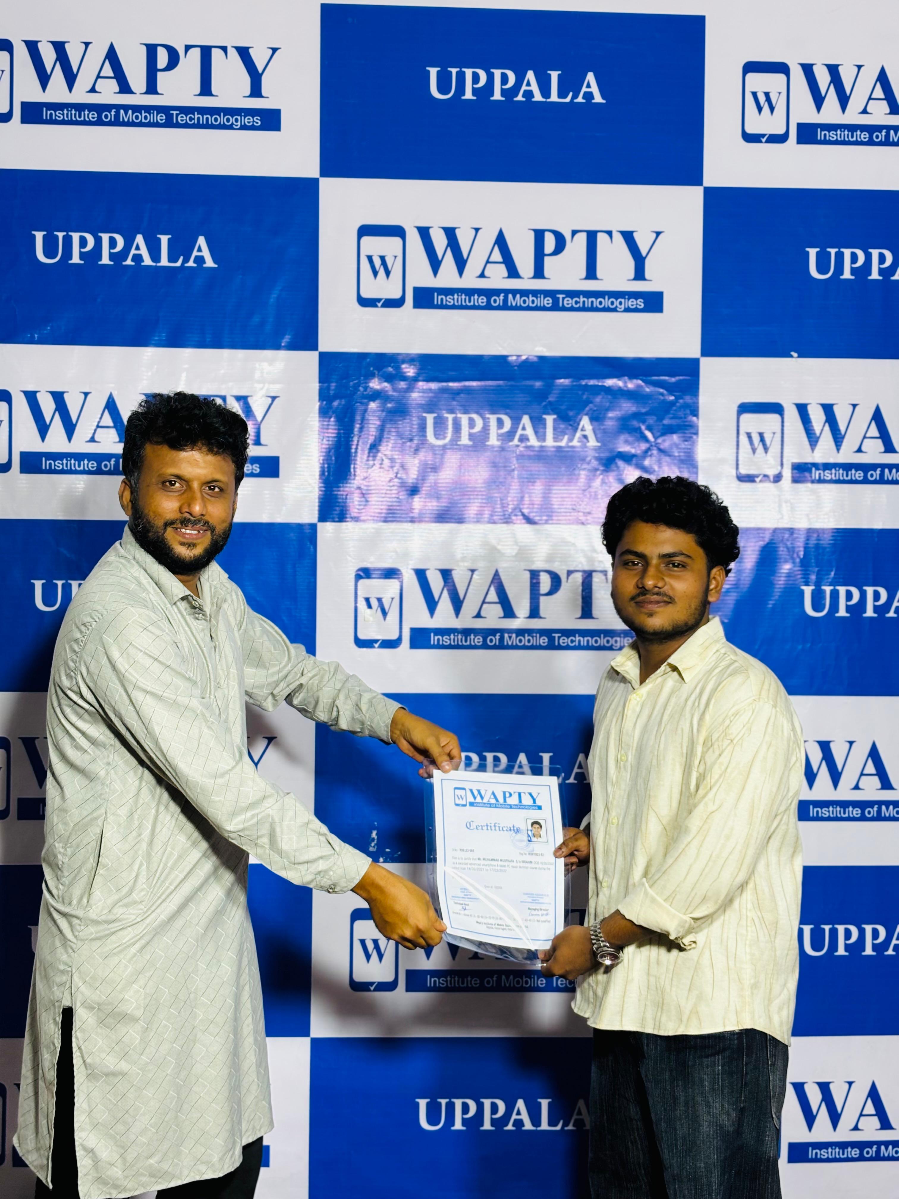 Students learning mobile app development in a classroom