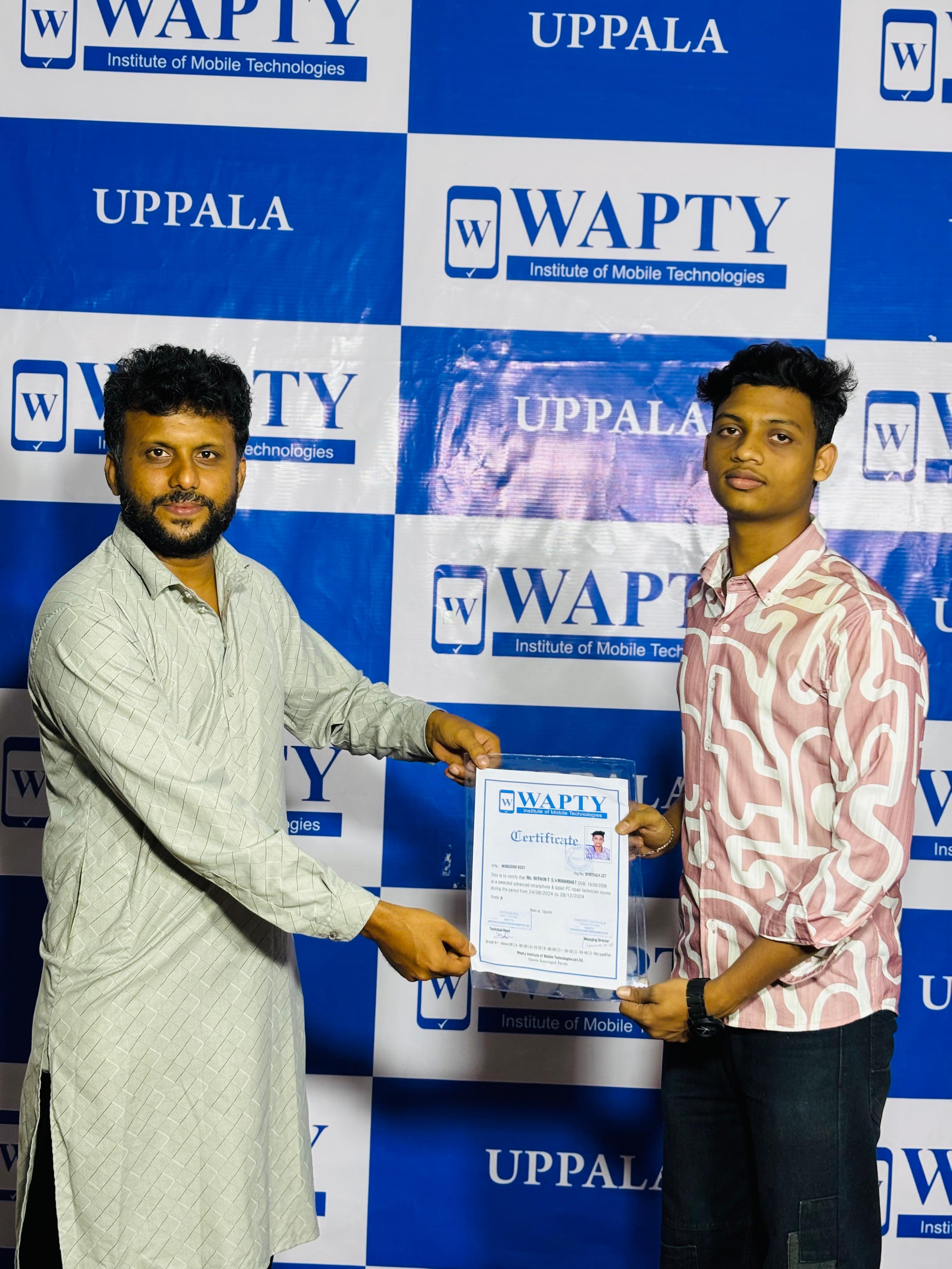 Students learning mobile app development in a classroom