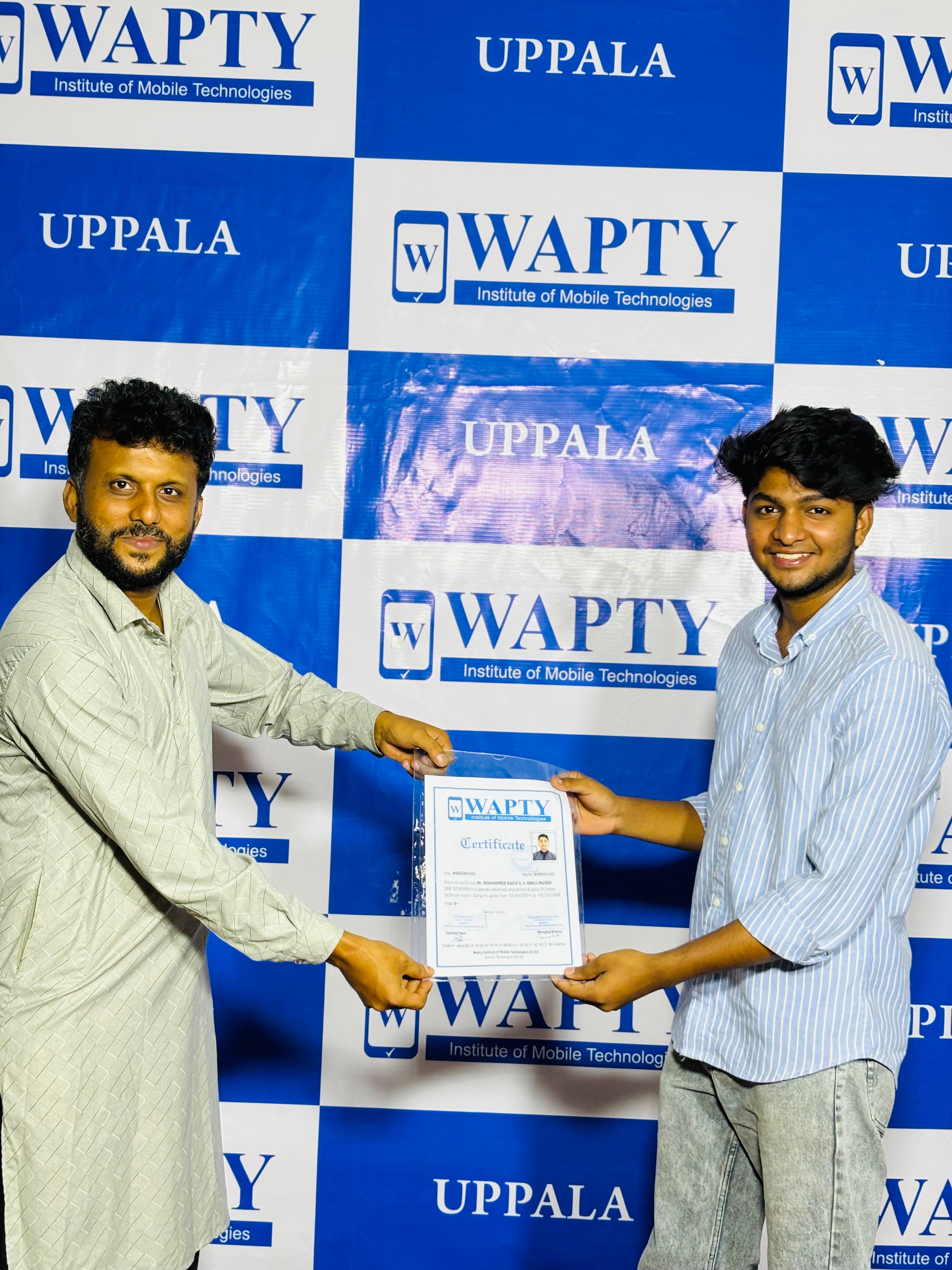 Students learning mobile app development in a classroom