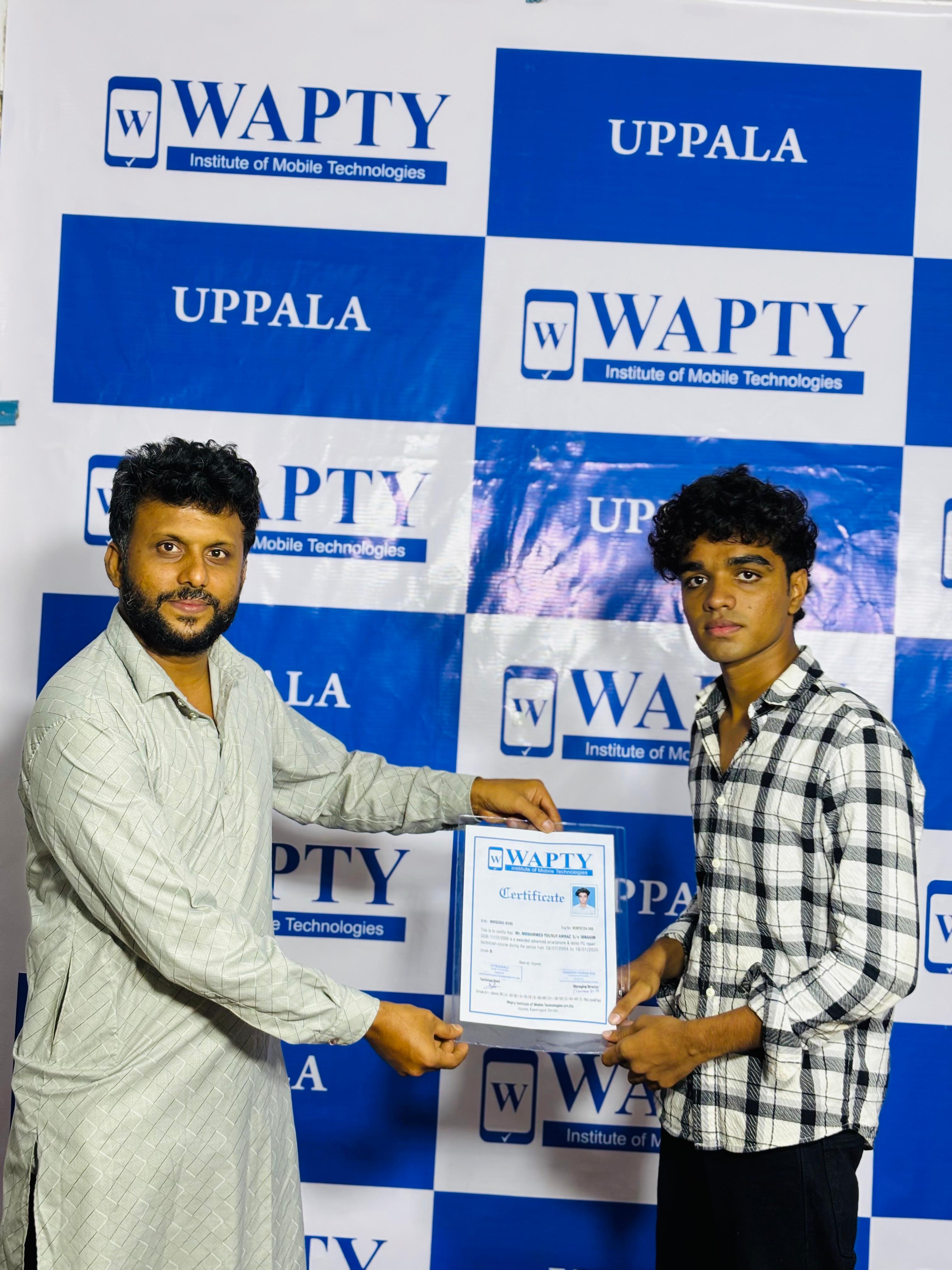 Students learning mobile app development in a classroom