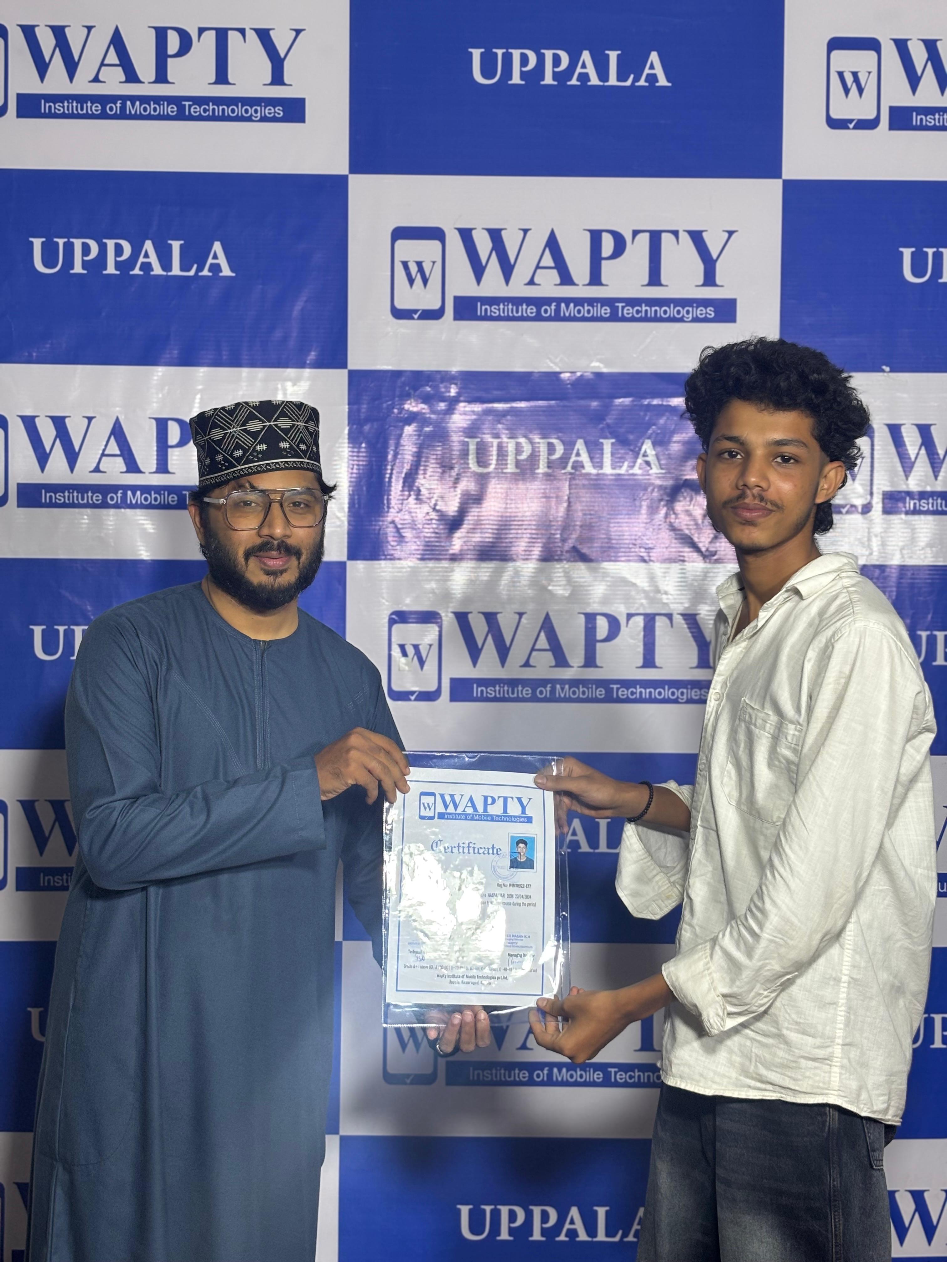 Students learning mobile app development in a classroom