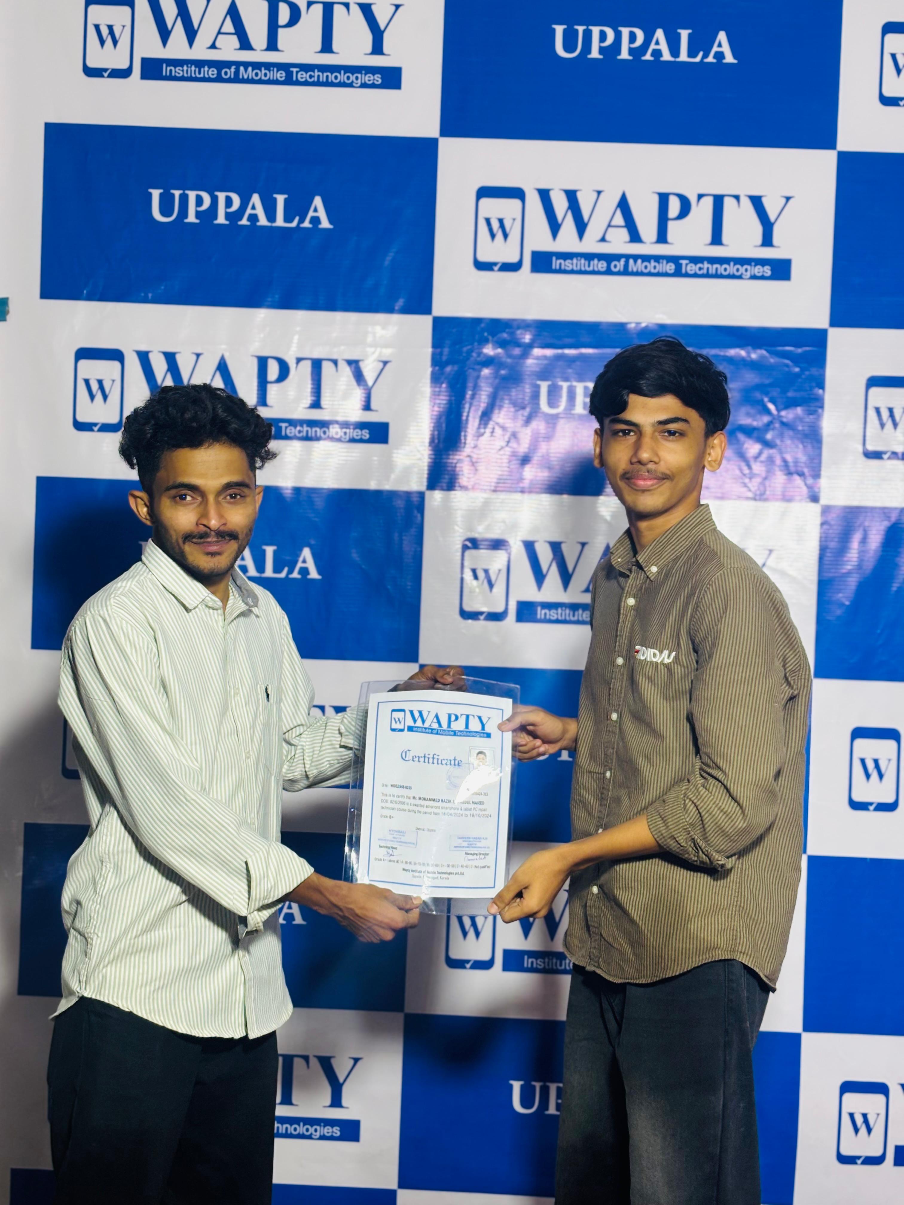 Students learning mobile app development in a classroom