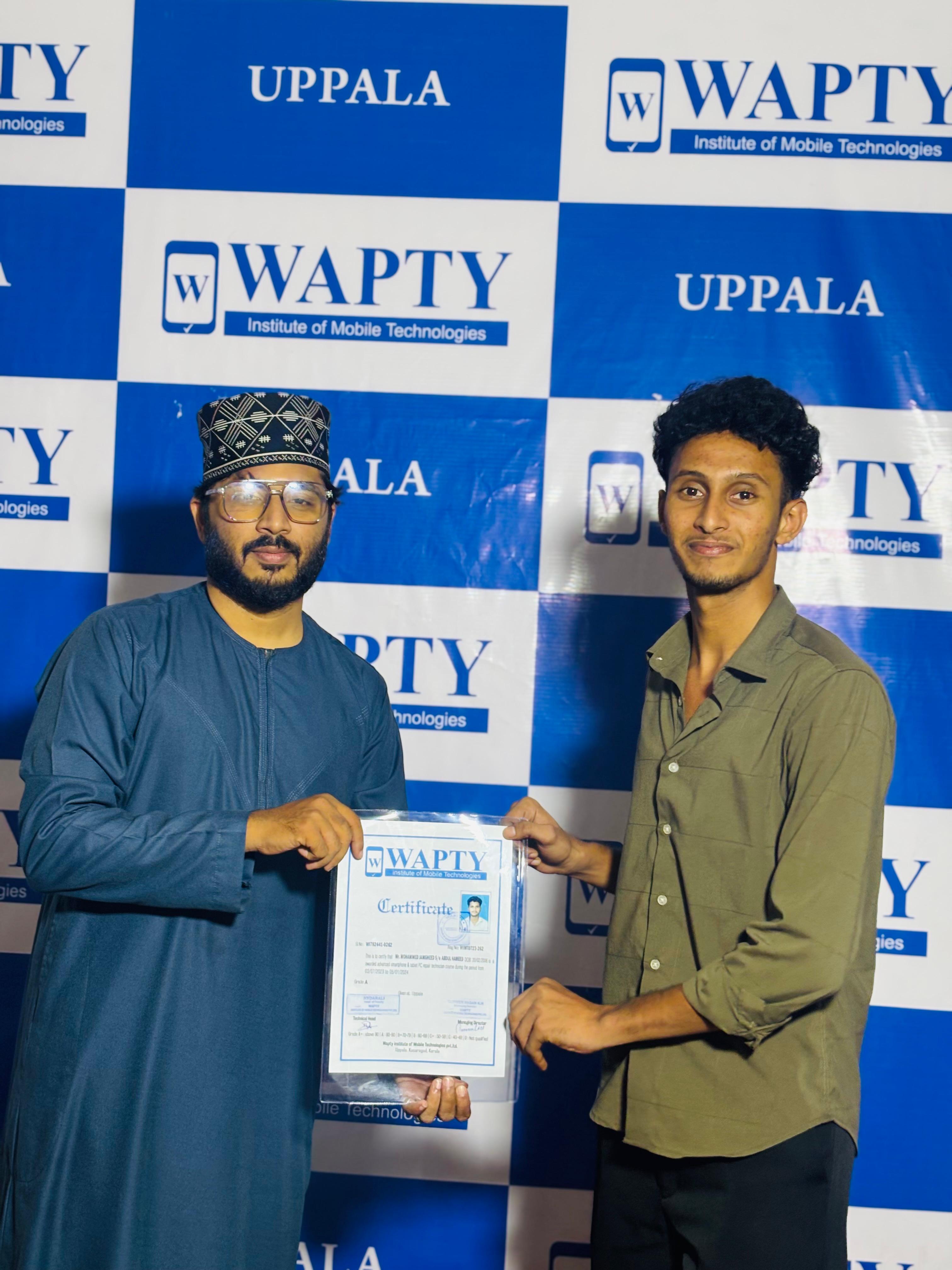 Students learning mobile app development in a classroom