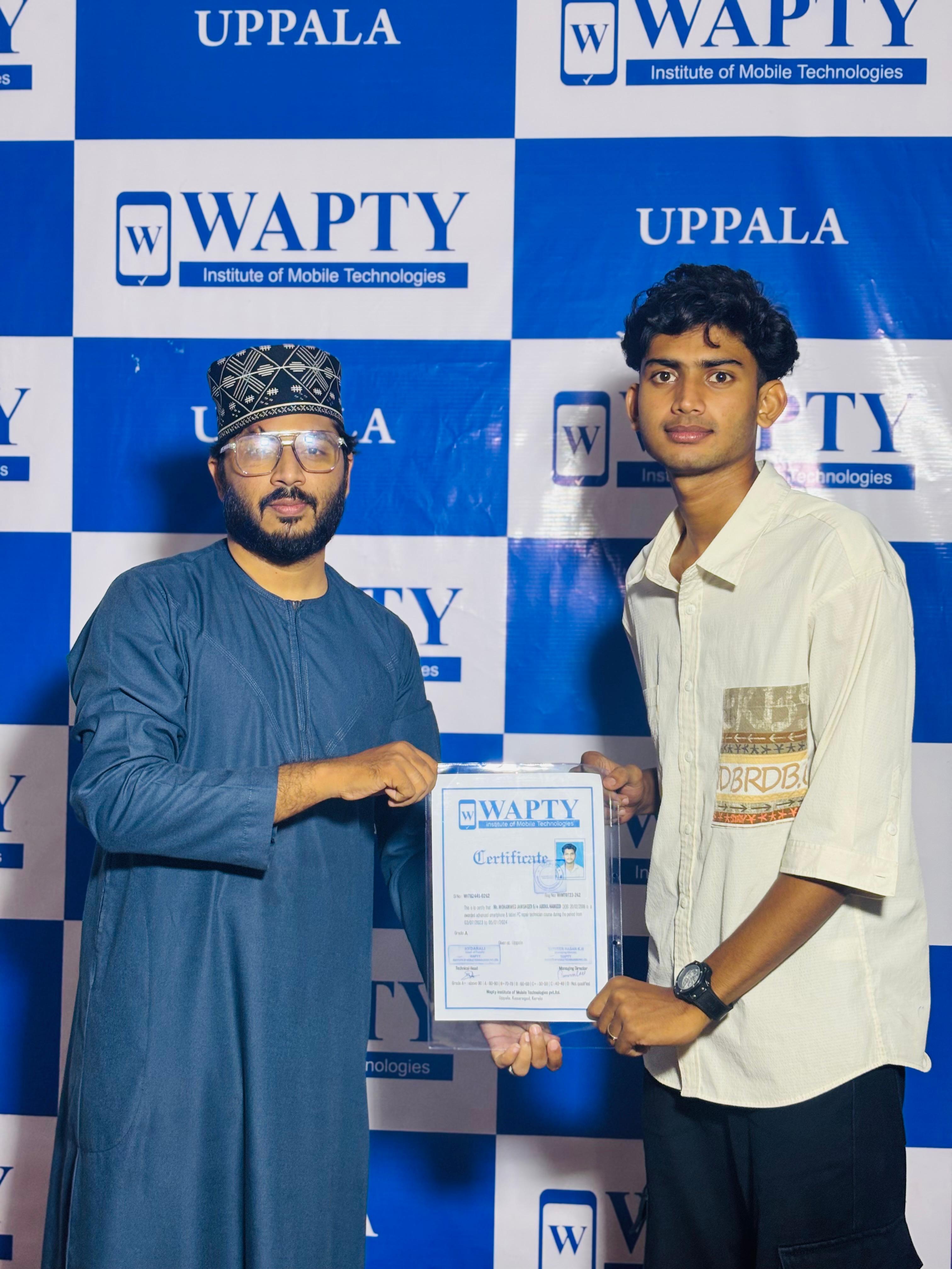 Students learning mobile app development in a classroom