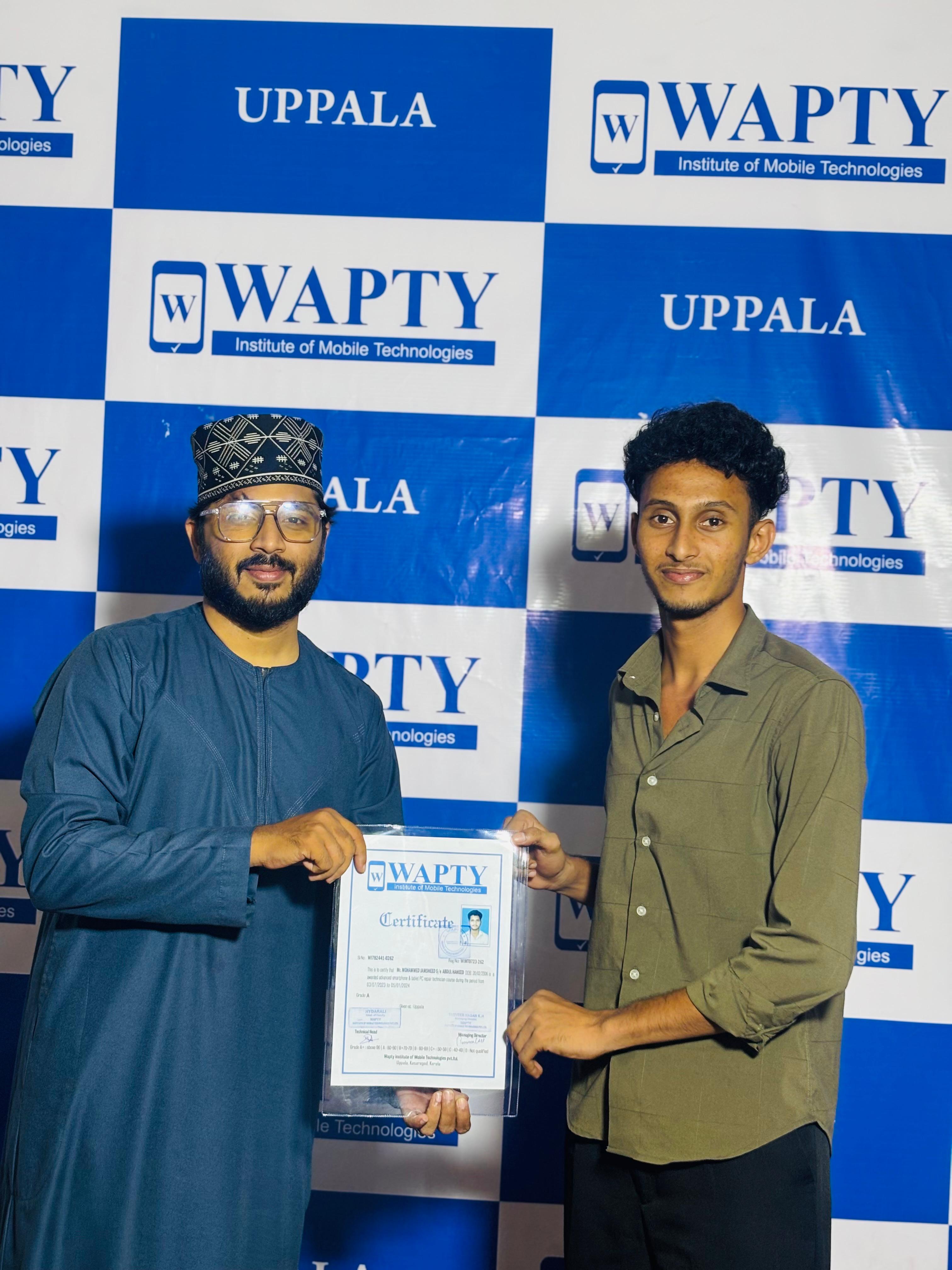 Students learning mobile app development in a classroom