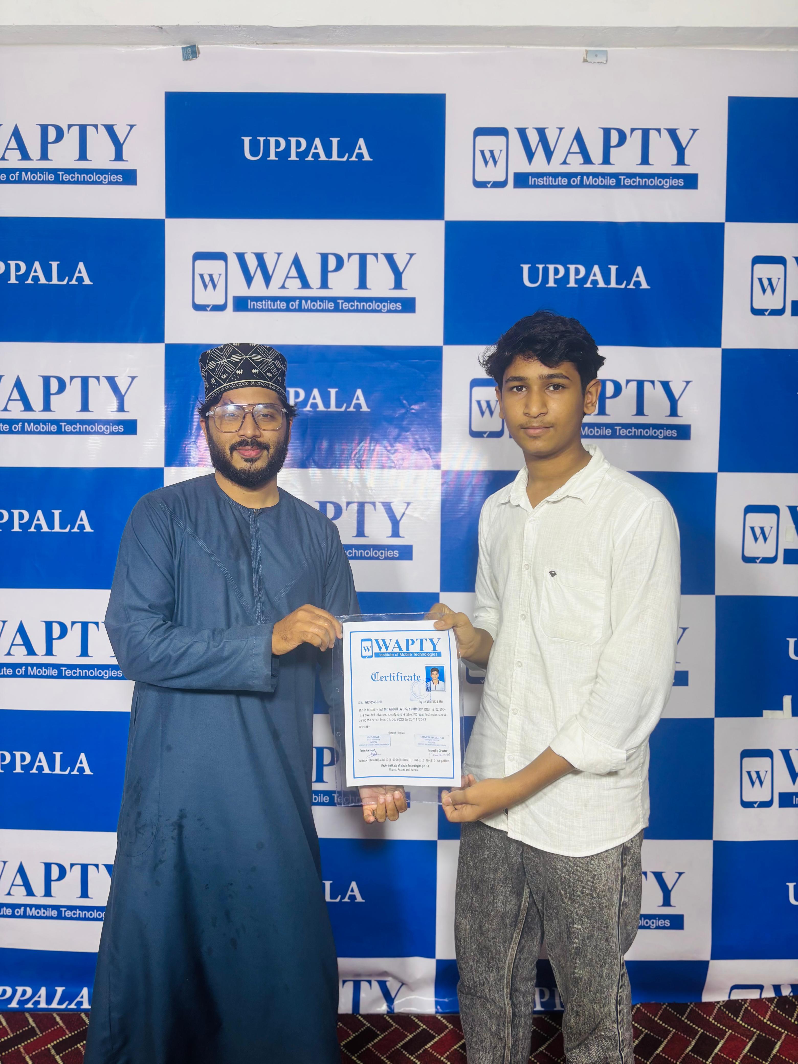 Students learning mobile app development in a classroom