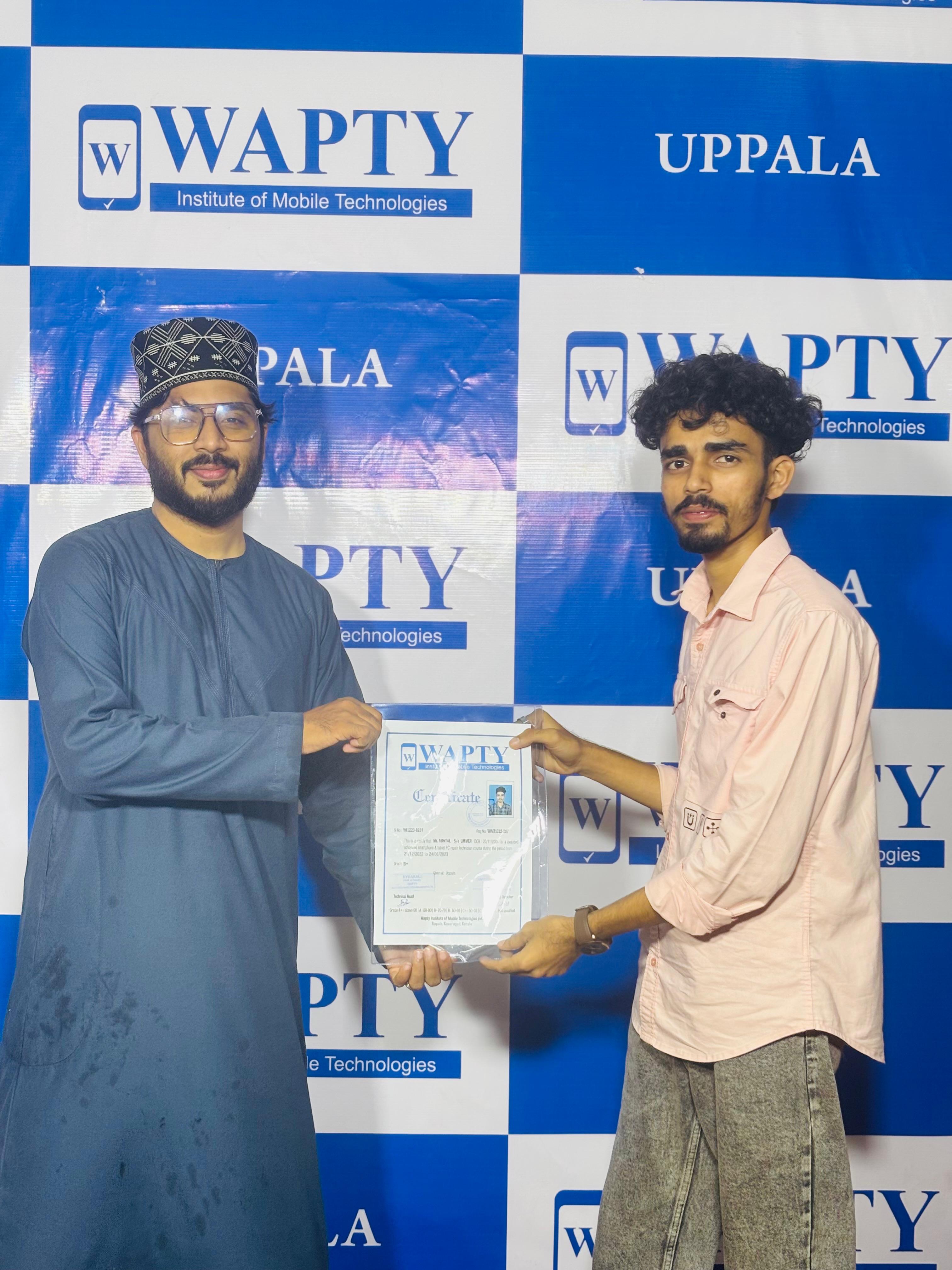 Students learning mobile app development in a classroom