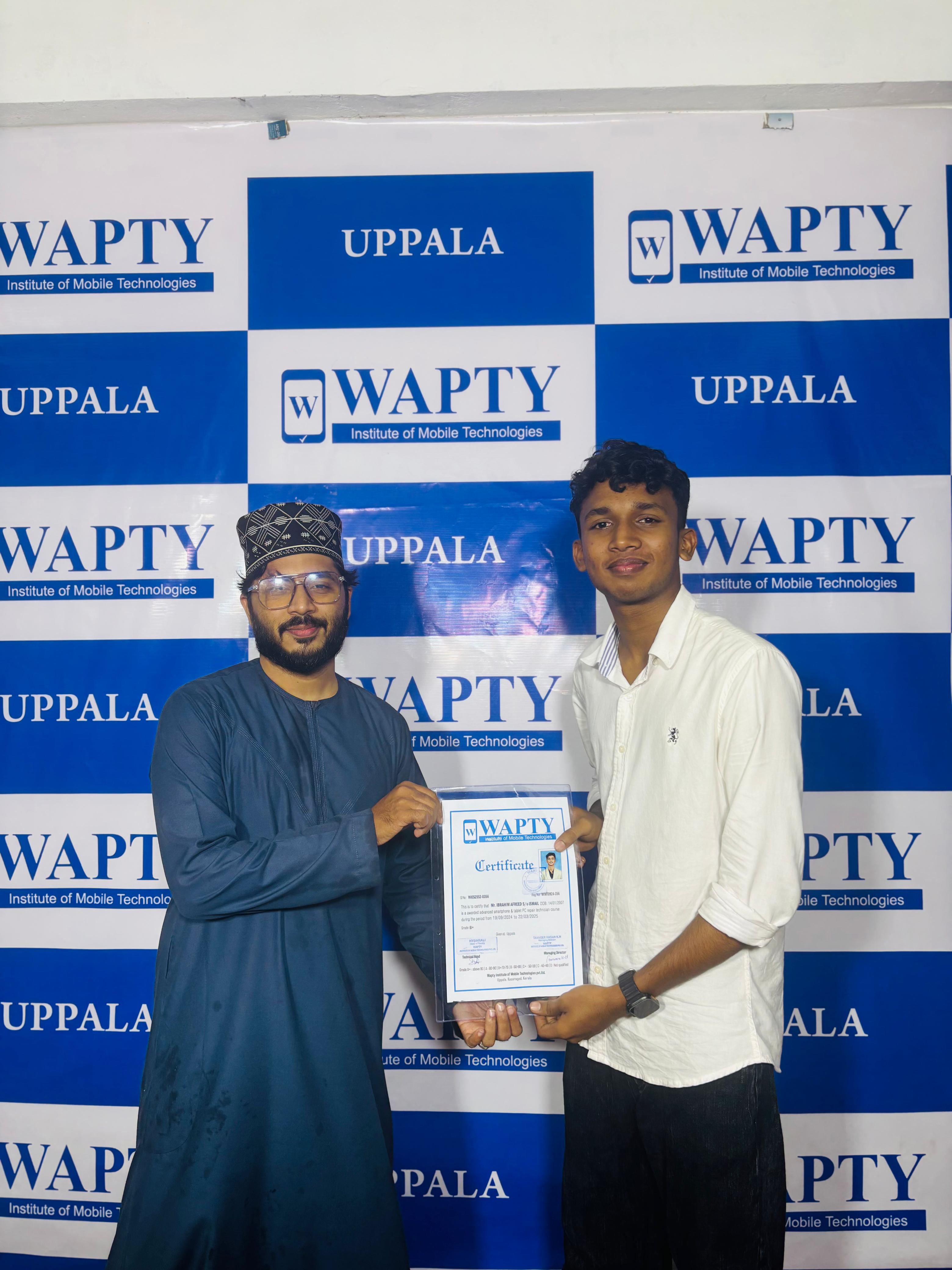 Students learning mobile app development in a classroom