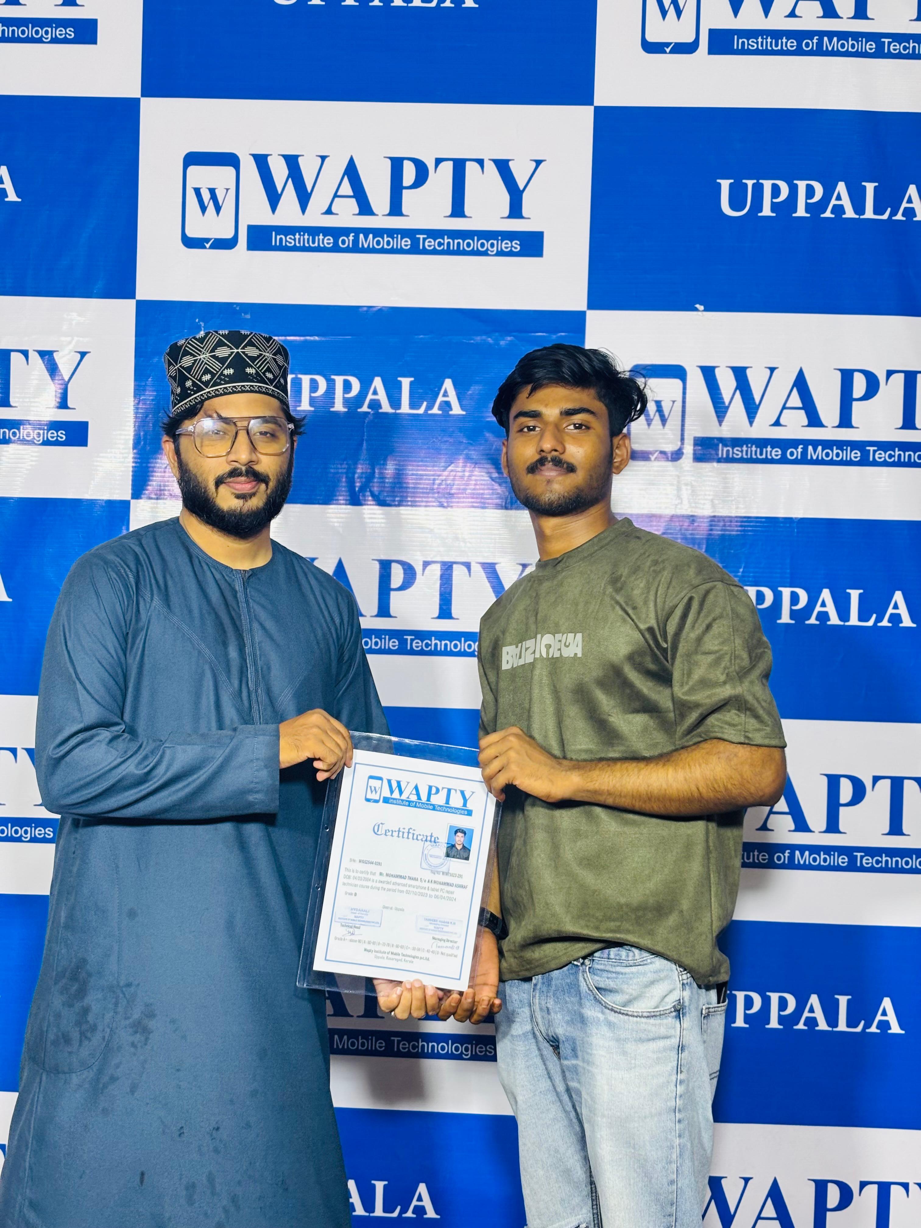 Students learning mobile app development in a classroom