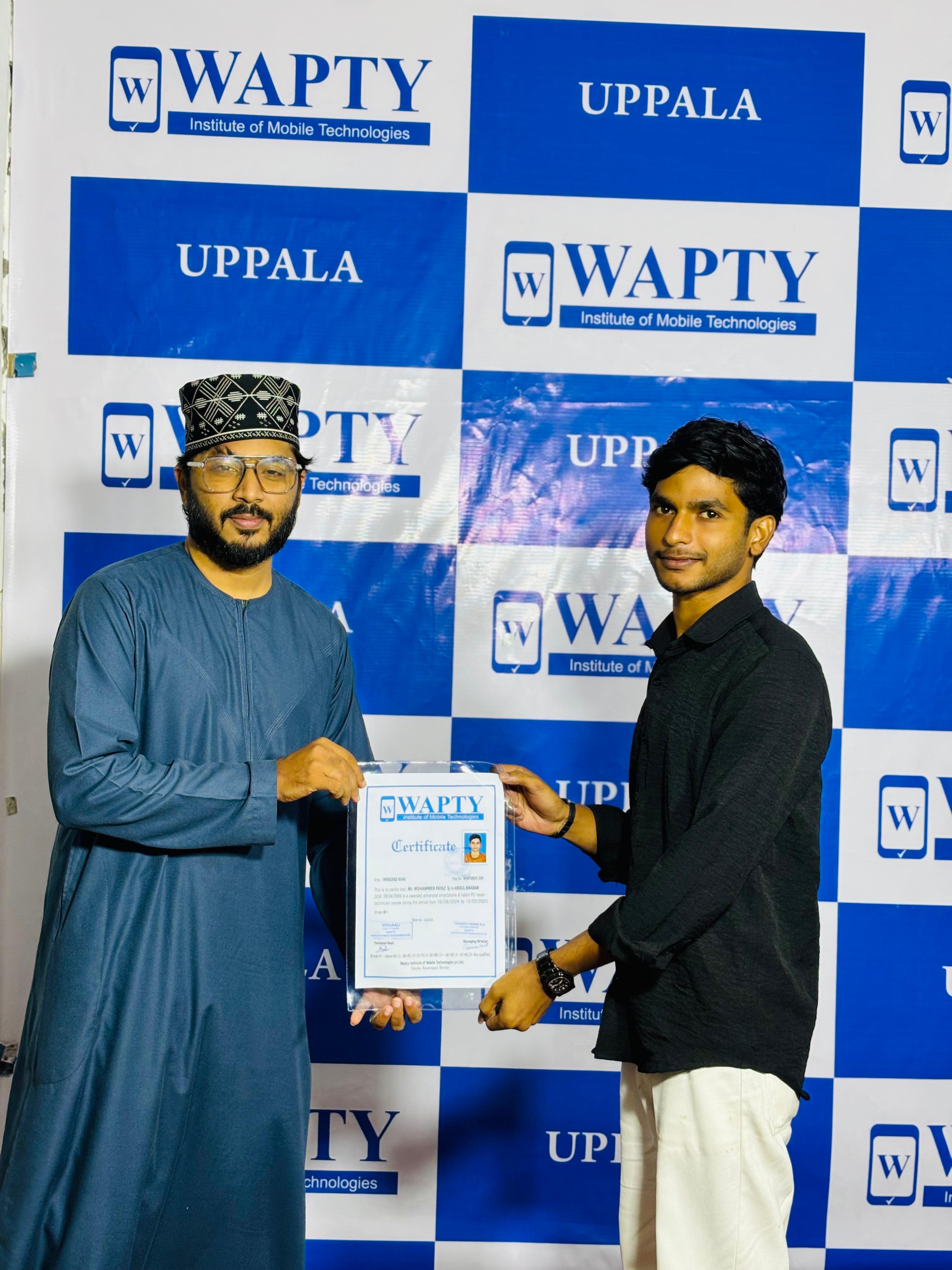 Students learning mobile app development in a classroom