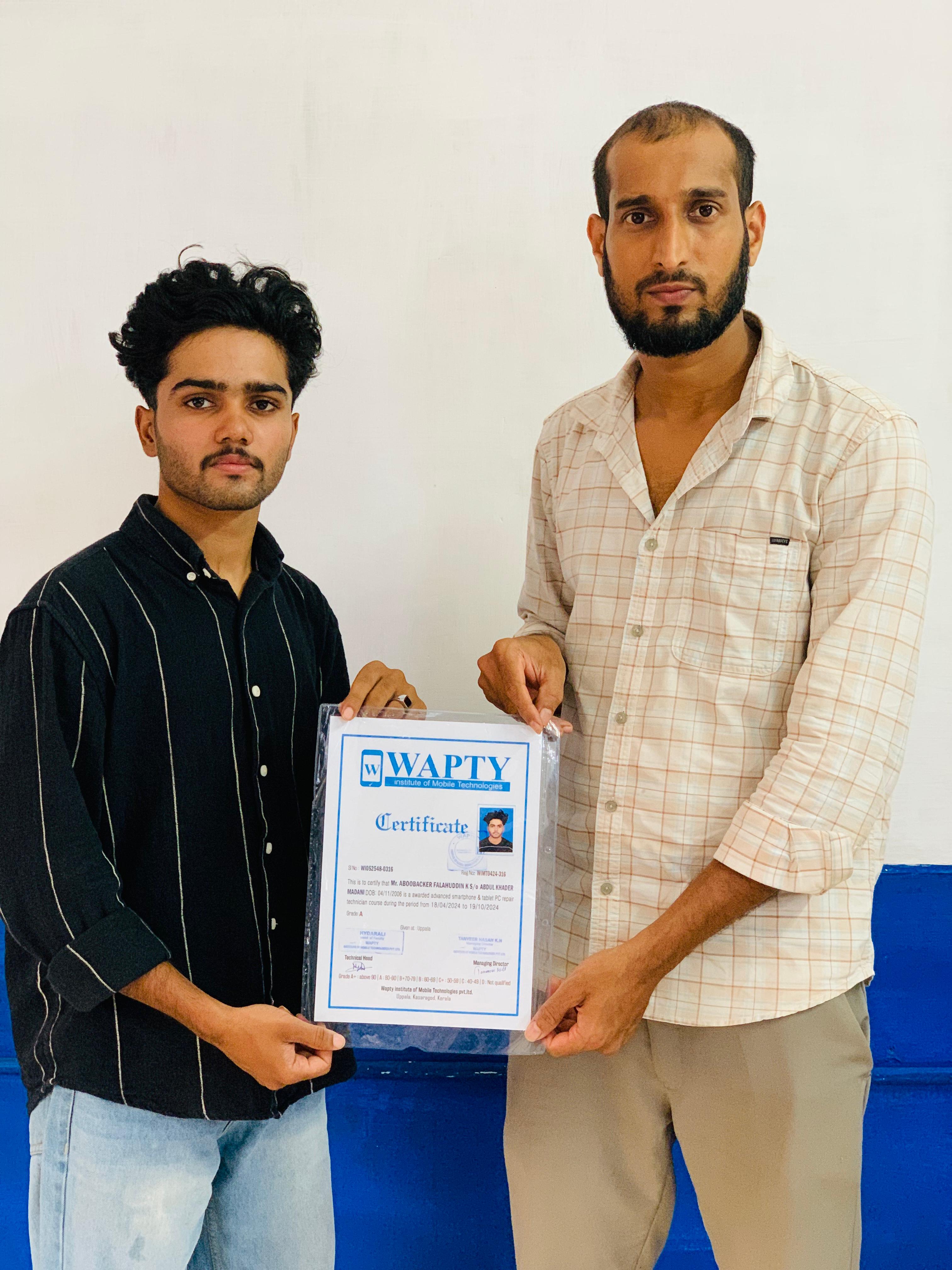 Students learning mobile app development in a classroom