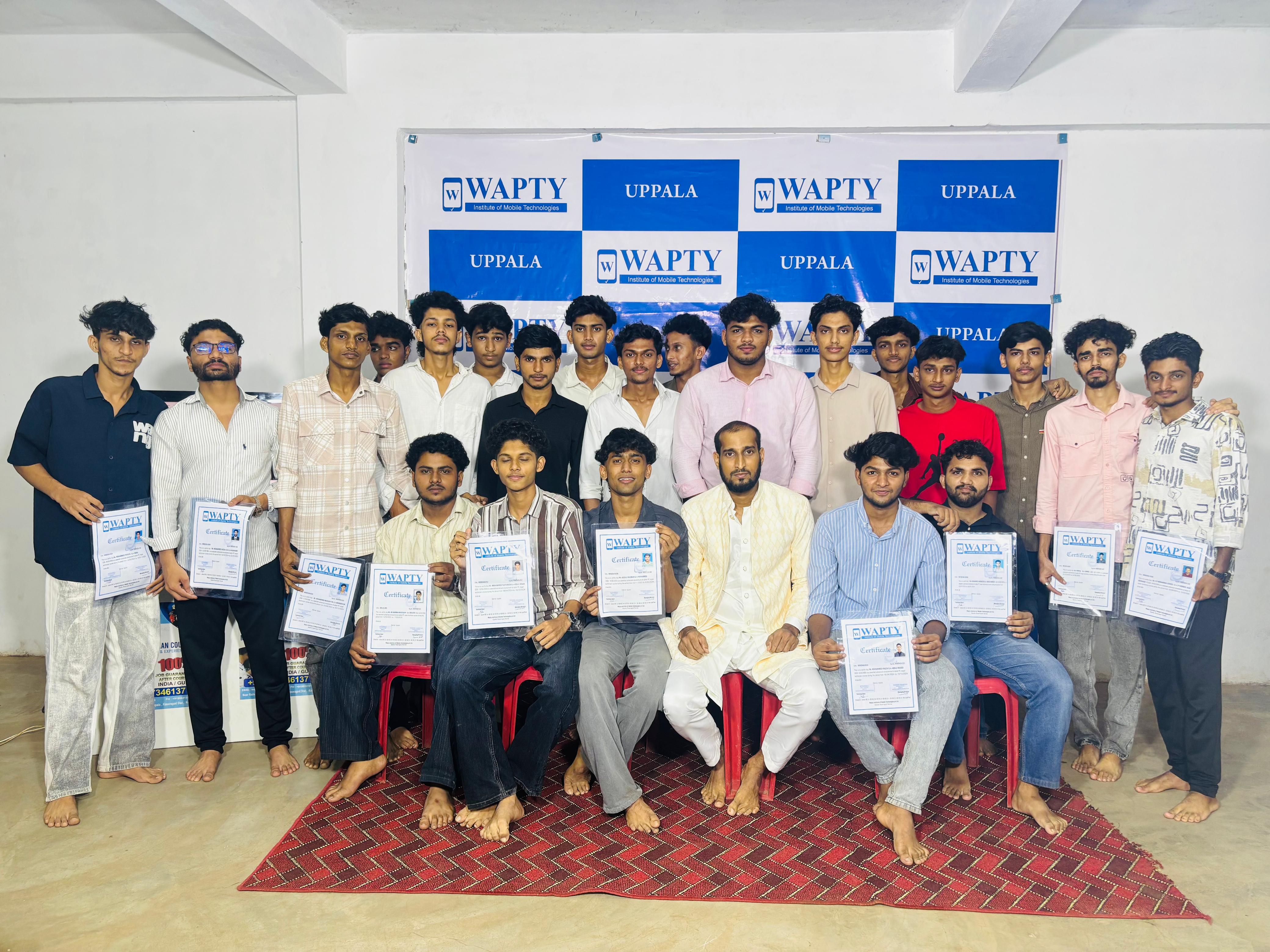 Students learning mobile app development in a classroom