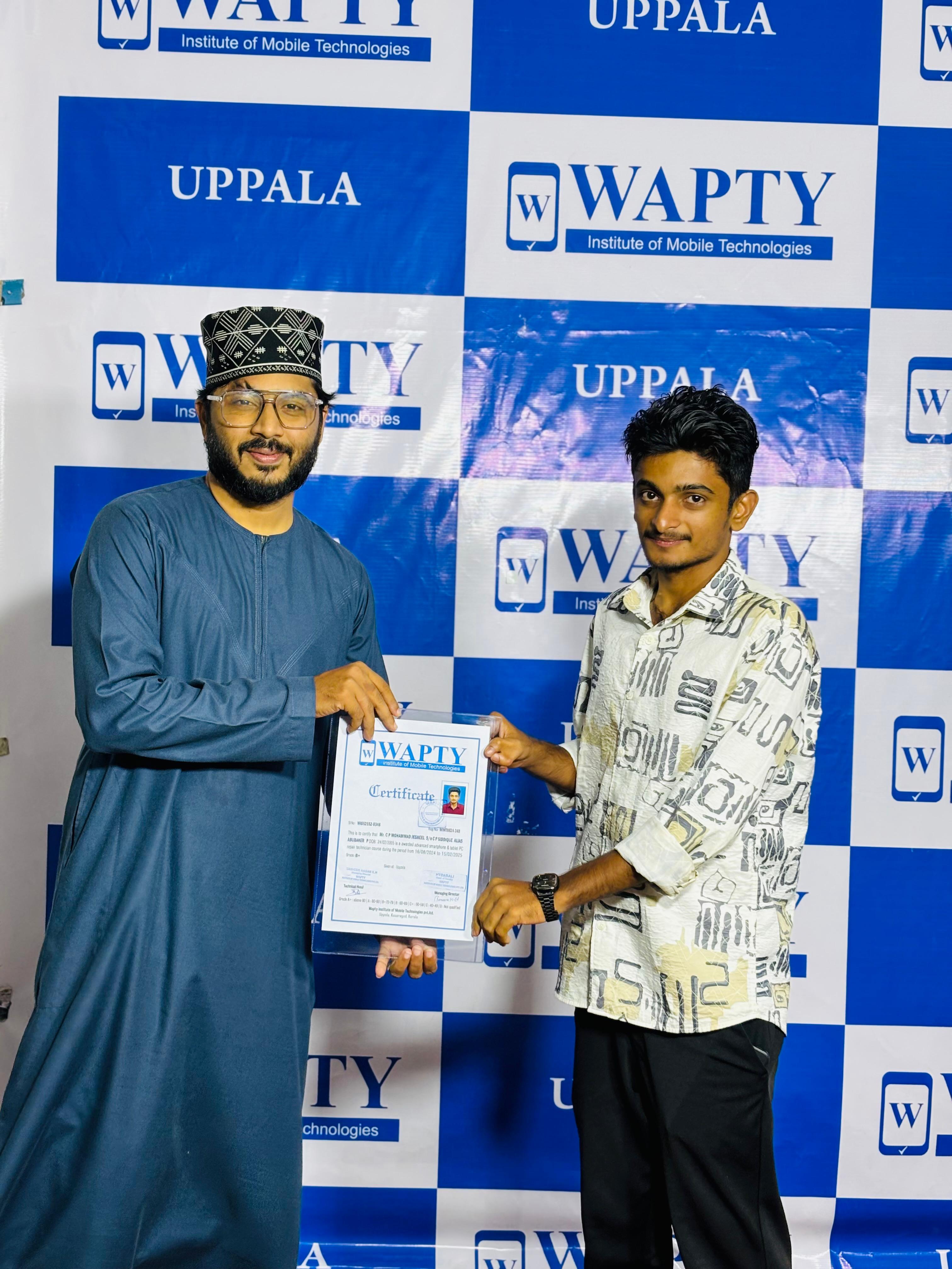 Students learning mobile app development in a classroom