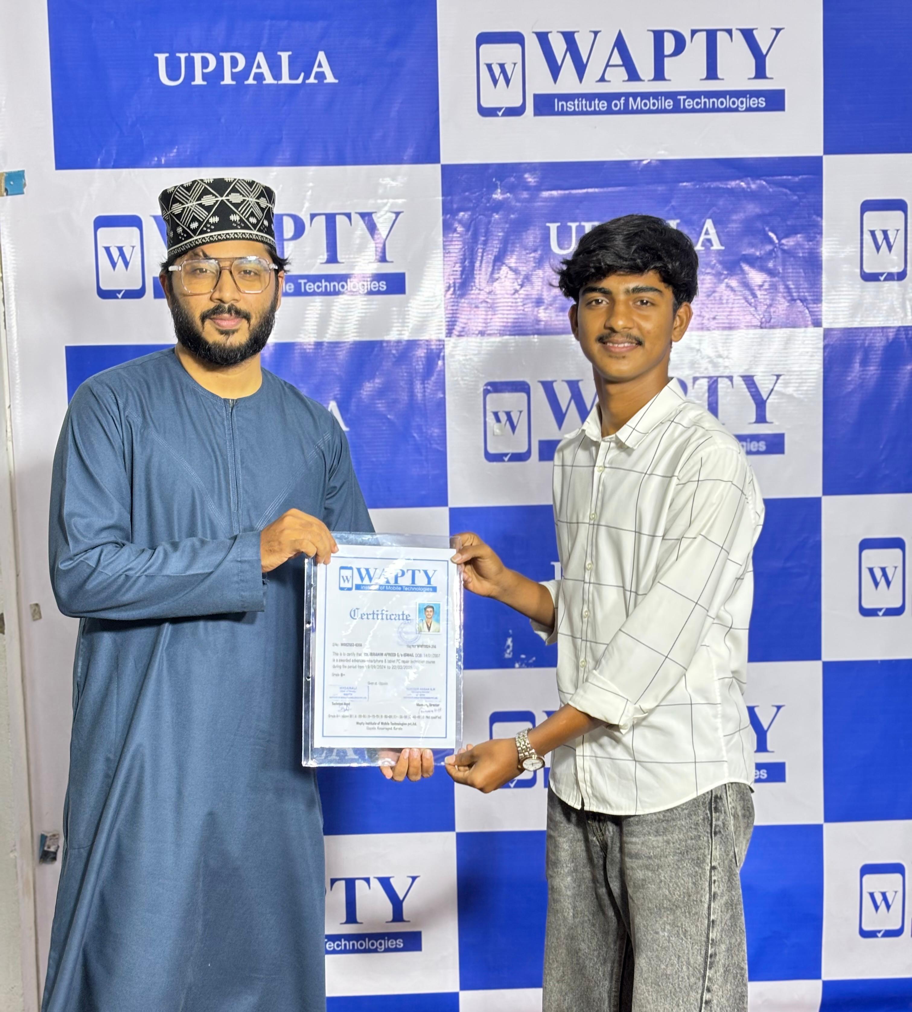 Students learning mobile app development in a classroom