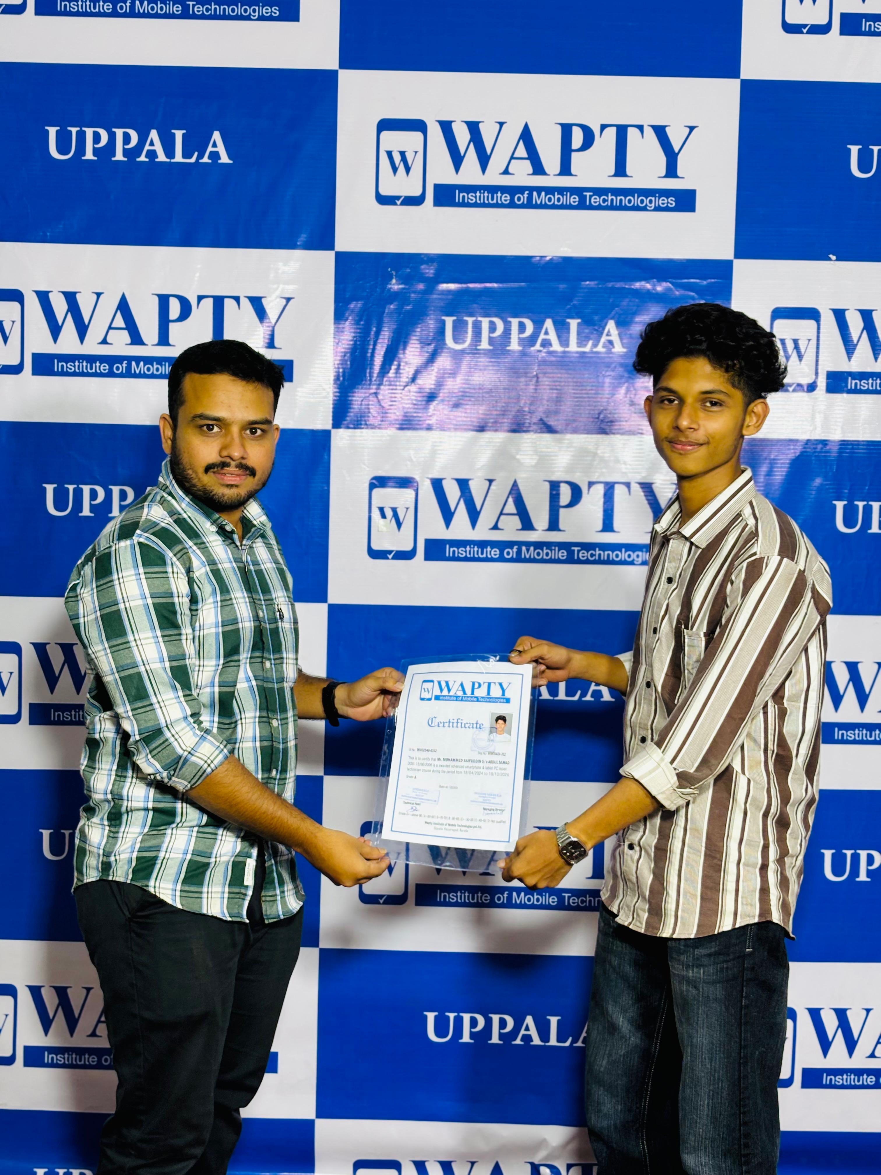 Students learning mobile app development in a classroom