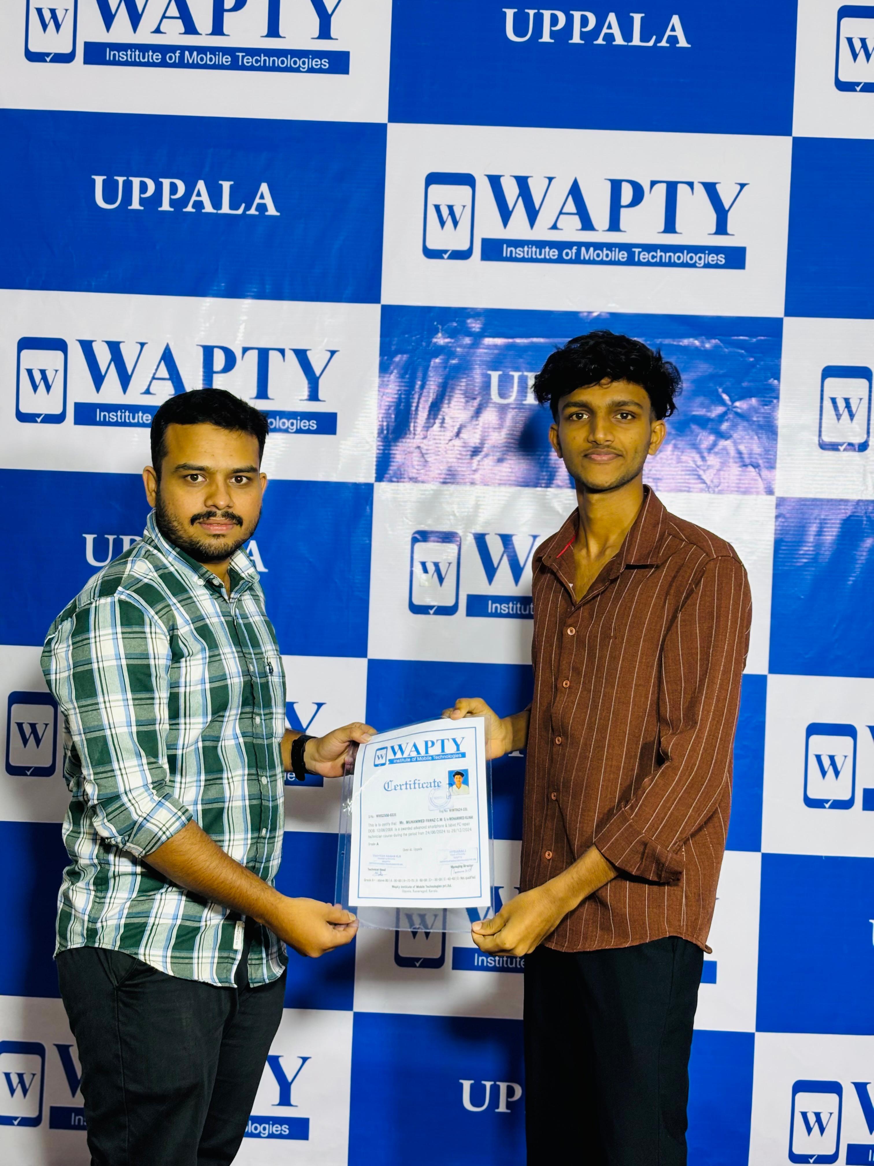 Students learning mobile app development in a classroom