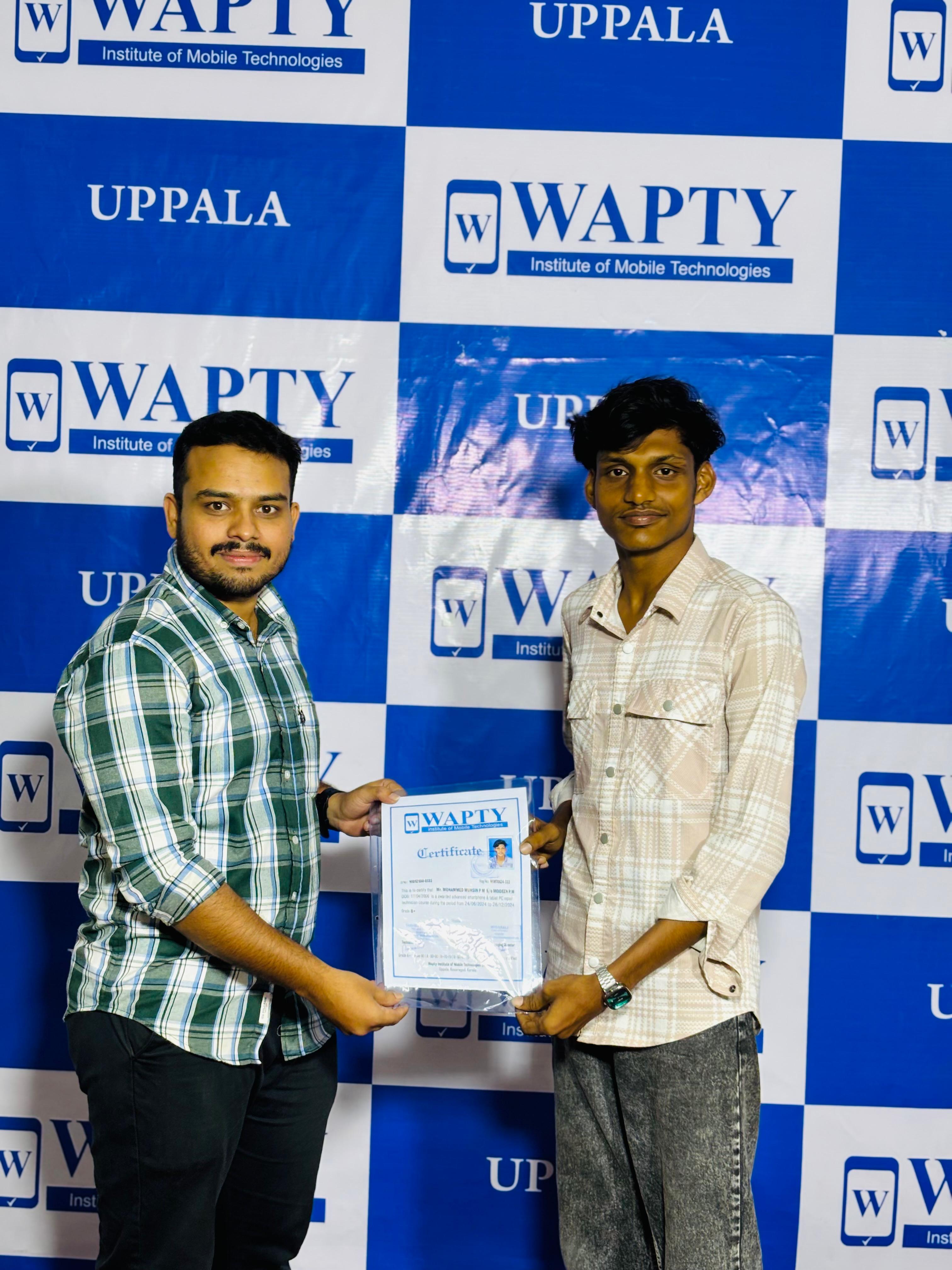 Students learning mobile app development in a classroom