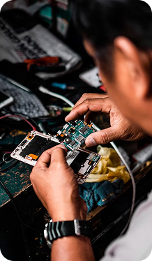 Students learning mobile app development in a classroom