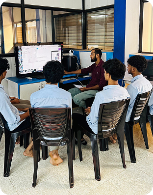 Students learning mobile app development in a classroom