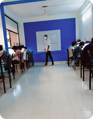 Students learning mobile app development in a classroom