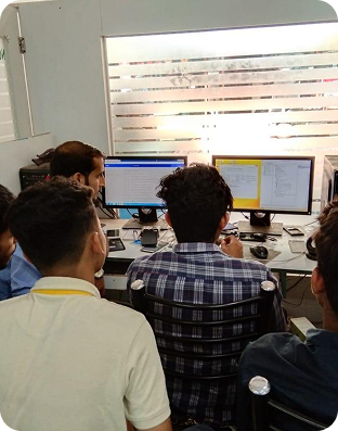 Students learning mobile app development in a classroom