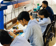 Students learning mobile app development in a classroom