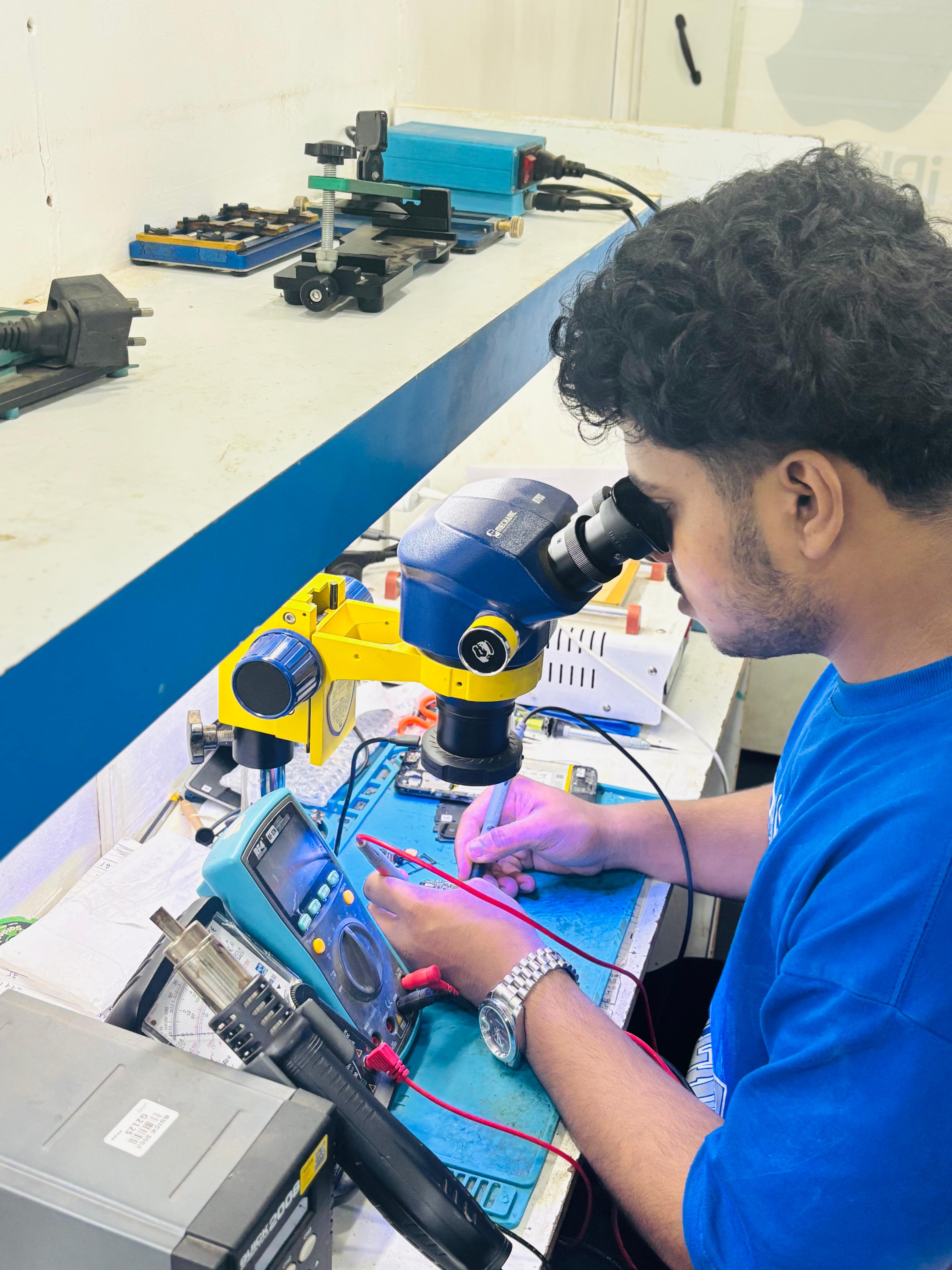 Students learning mobile app development in a classroom