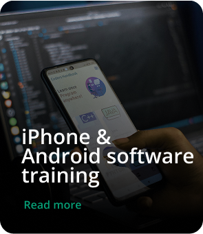 Students learning mobile app development in a classroom